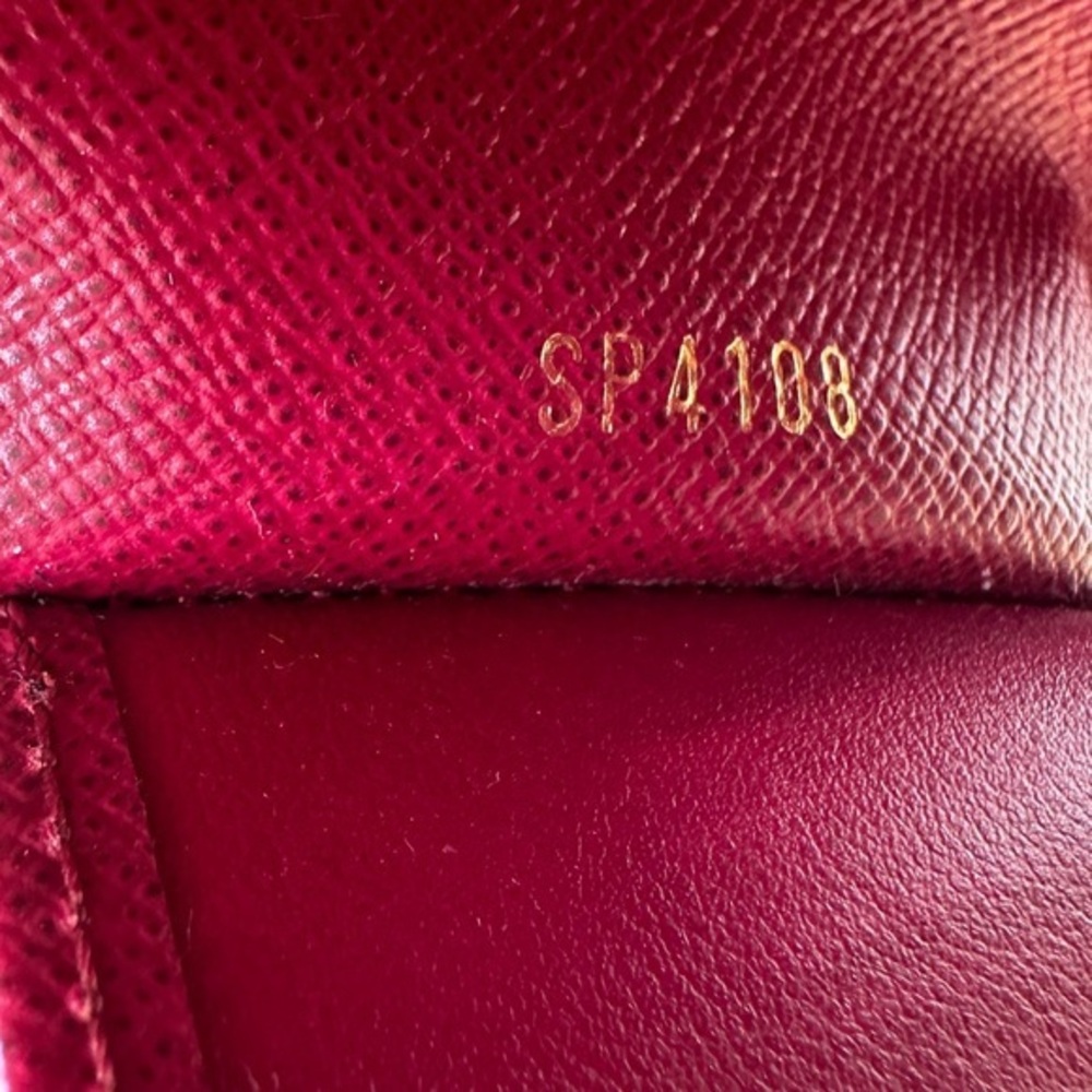 AUTHENTIC Louis Vuitton key holder. Monogram pattern. Magenta interior. - Picture 15 of 15